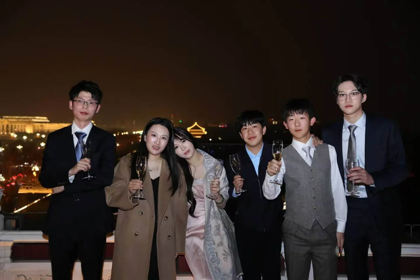 Friends together outdoors at night